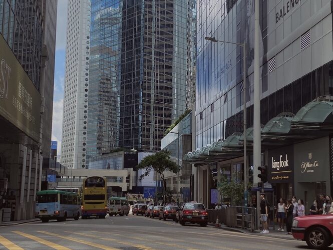 Where to Stay in Hong Kong for Solo Travelers (Best Areas to Meet People) Hong Kong Island Central district with modern skyscrapers and busy city streets